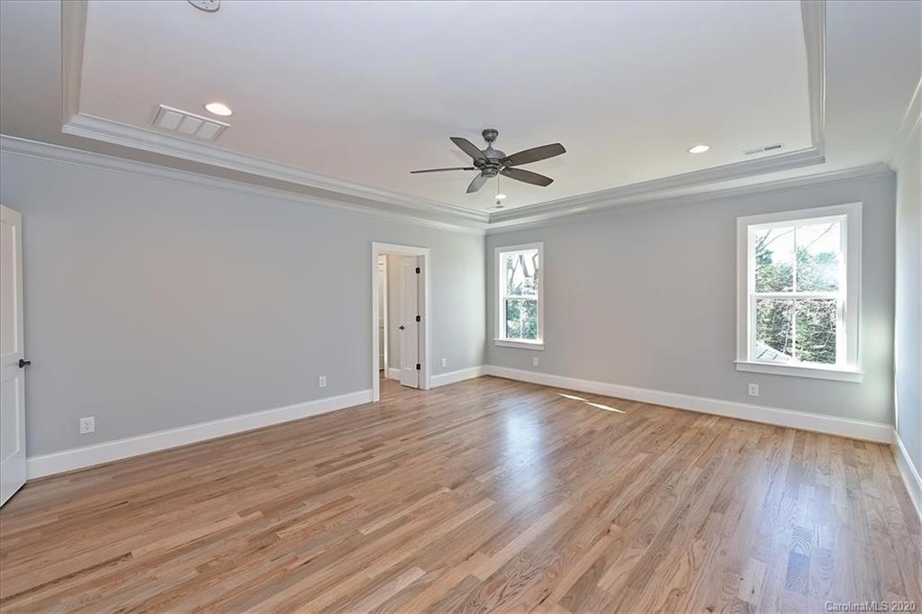 608 Marsh Road Charlotte, NC 28209 - Photo 18 of 31 a view of an empty room with a window and wooden floor
