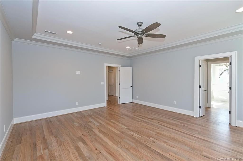 608 Marsh Road Charlotte, NC 28209 - Photo 19 of 31 a view of a big room with wooden floor and windows
