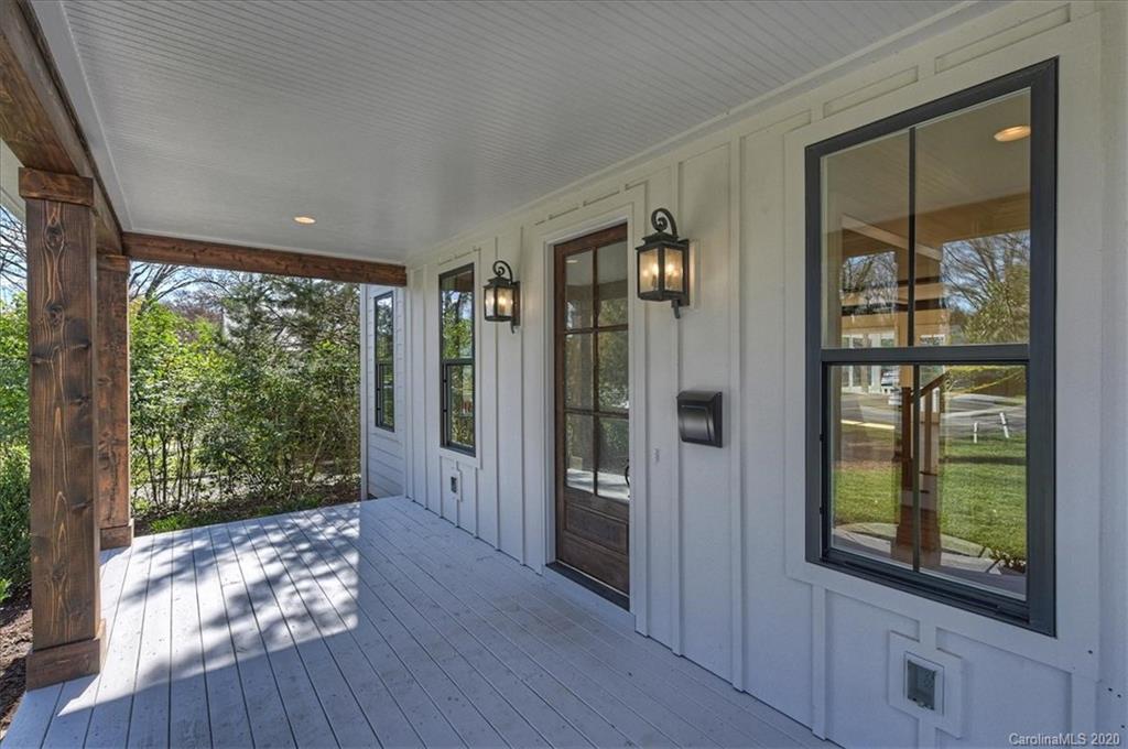 608 Marsh Road Charlotte, NC 28209 - Photo 3 of 31 a view of hallway with a large window and wooden floor