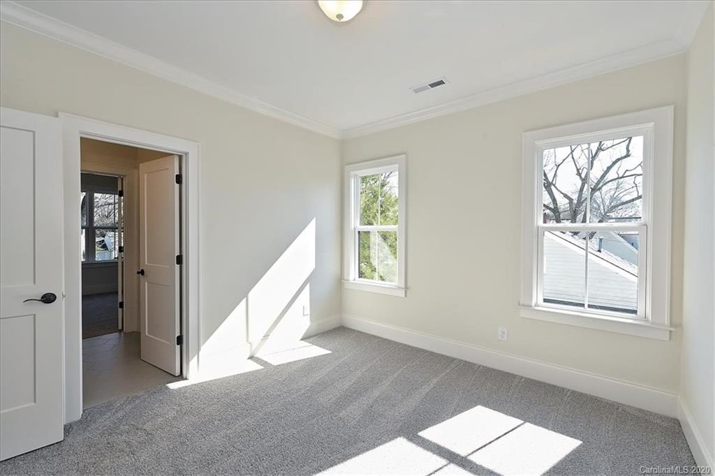 608 Marsh Road Charlotte, NC 28209 - Photo 23 of 31 a view of an entryway with wooden floor and windows
