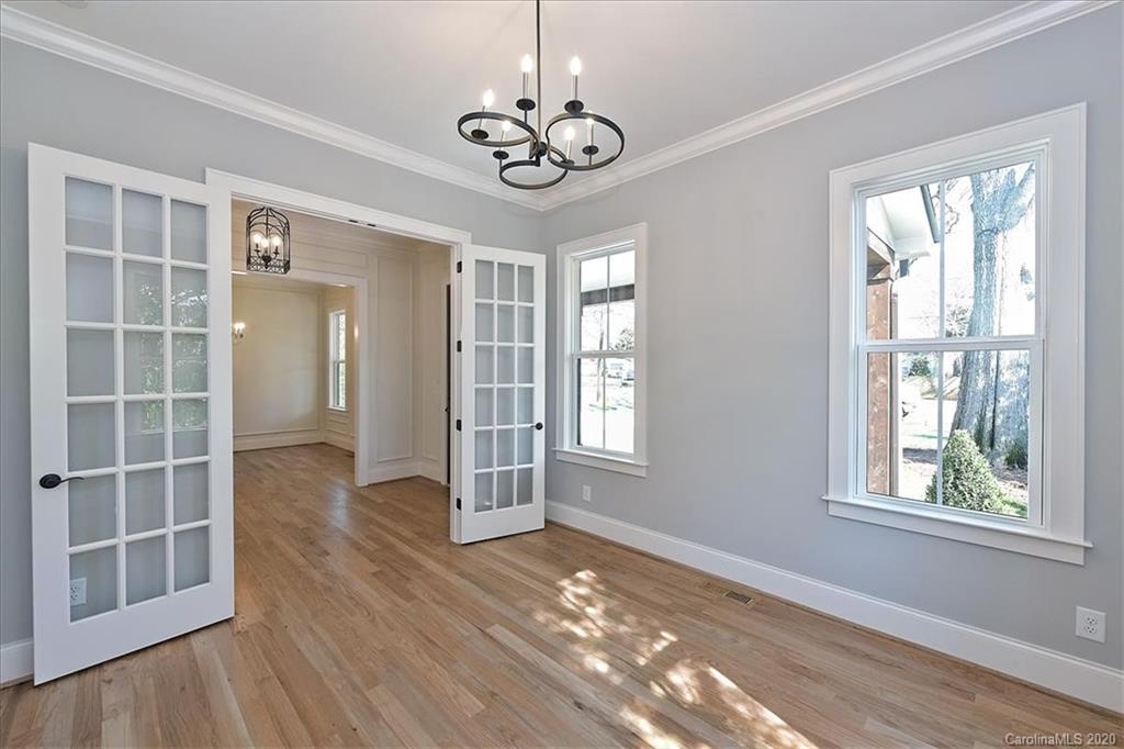 608 Marsh Road Charlotte, NC 28209 - Photo 4 of 31 a view of an empty room with wooden floor and a window