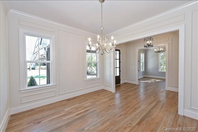 608 Marsh Road Charlotte, NC 28209 - Photo 7 of 31 a view of an empty room with wooden floor and a window
