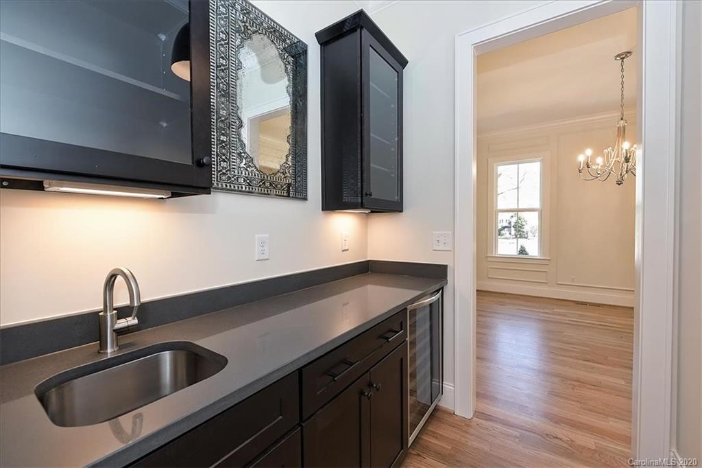 608 Marsh Road Charlotte, NC 28209 - Photo 8 of 31 a kitchen with a sink and a mirror