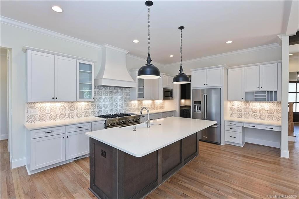 608 Marsh Road Charlotte, NC 28209 - Photo 9 of 31 a kitchen with a sink stove and cabinets