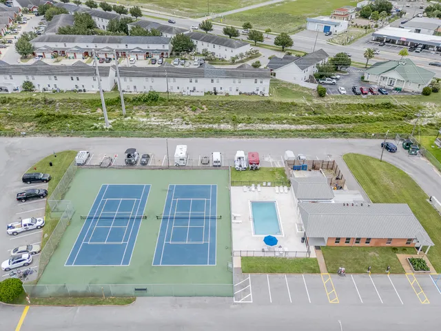 a view of houses with outdoor space and lake view