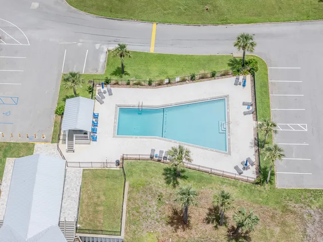 a view of a swimming pool with a lounge chair