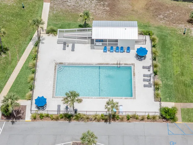 a view of a lake with houses in the back