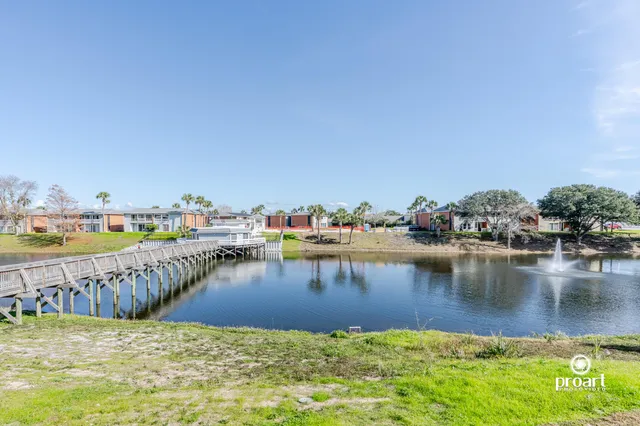 an aerial view of residential building and car parked on road