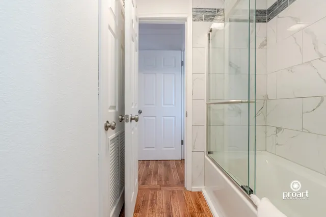 a bathroom with a bathtub and shower