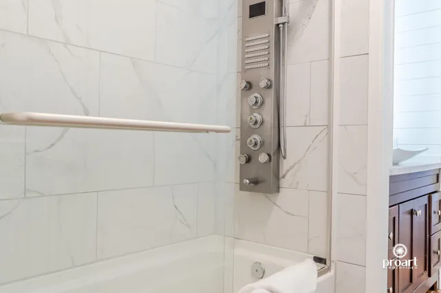 a bathroom with a granite countertop sink
