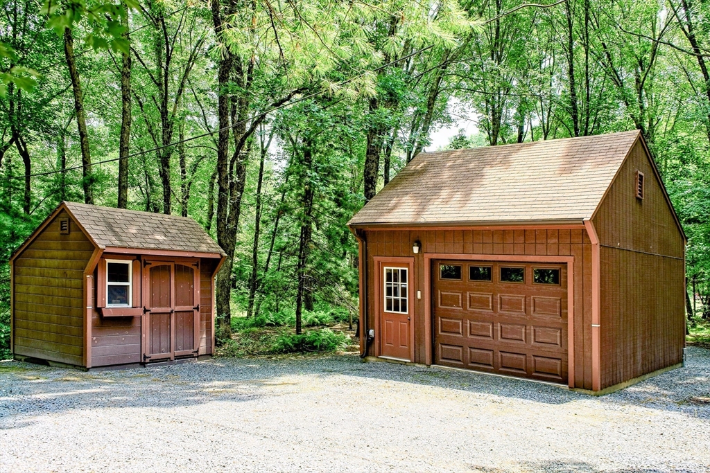 8 Fredrickson Road Norfolk, MA 02056 - Photo 11 of 39 a front view of a house with a garage