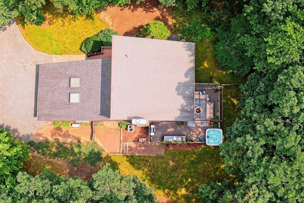 8 Fredrickson Road Norfolk, MA 02056 - Photo 14 of 39 a backyard of a house with table and chairs