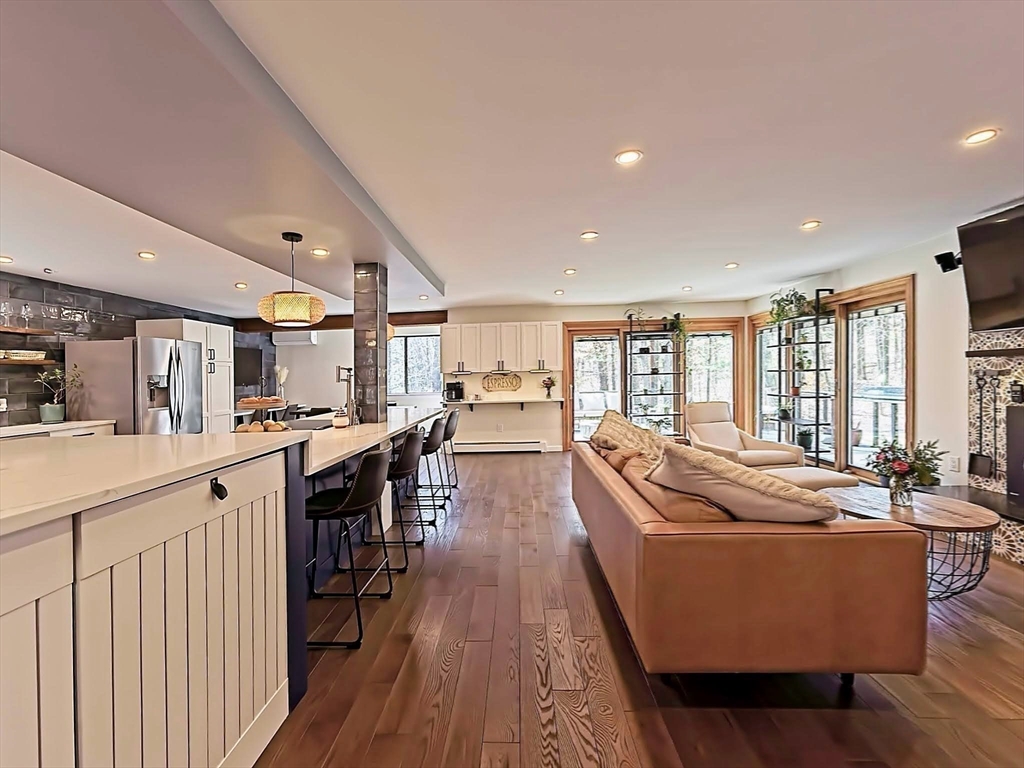 8 Fredrickson Road Norfolk, MA 02056 - Photo 17 of 39 a living room with stainless steel appliances granite countertop lots of counter top space and furniture