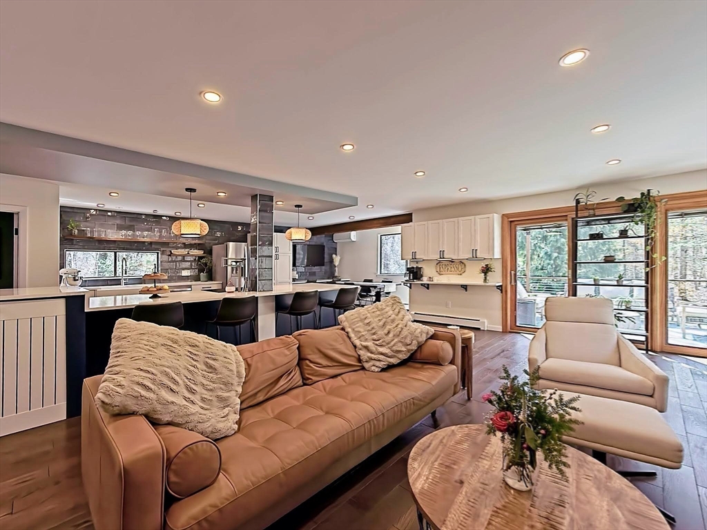 8 Fredrickson Road Norfolk, MA 02056 - Photo 20 of 39 a living room with furniture kitchen view and large windows