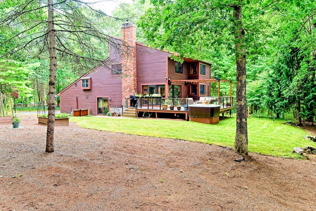 8 Fredrickson Road Norfolk, MA 02056 - Photo 2 of 39 a house view with a garden space