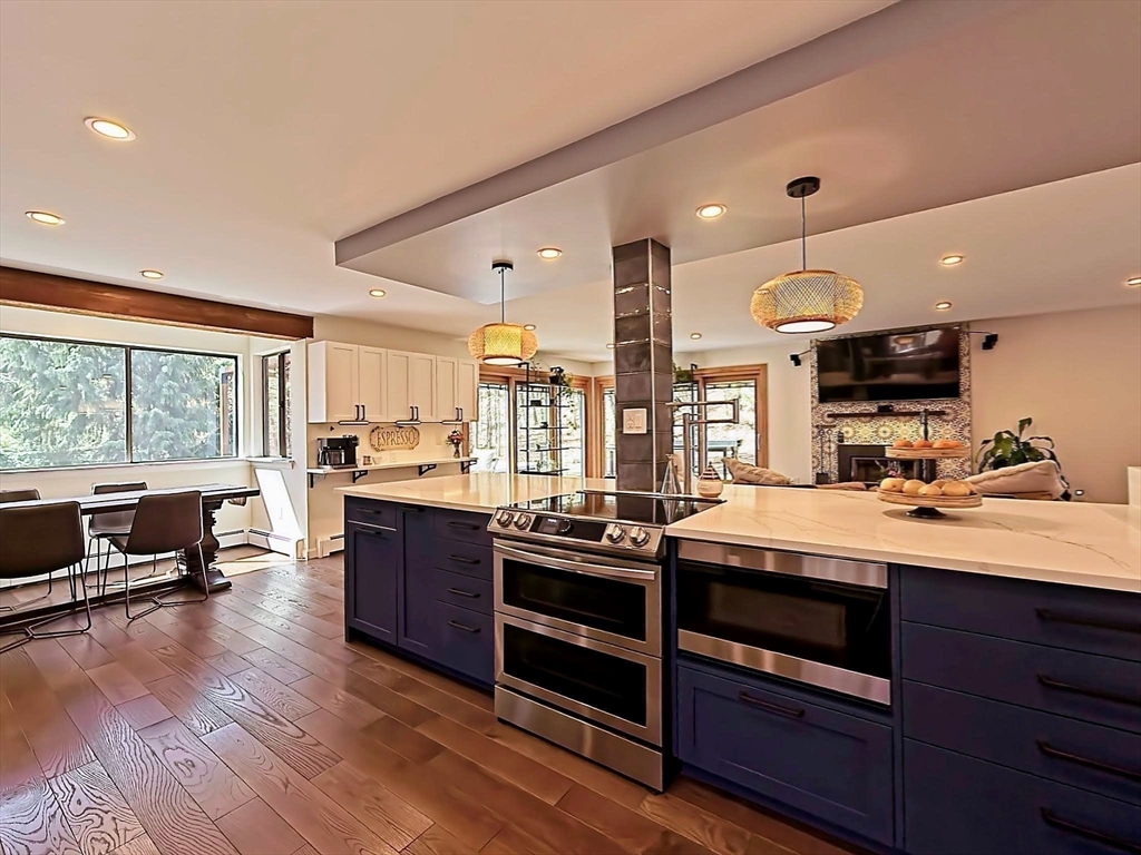 8 Fredrickson Road Norfolk, MA 02056 - Photo 23 of 39 a kitchen with stainless steel appliances granite countertop a stove and a large window