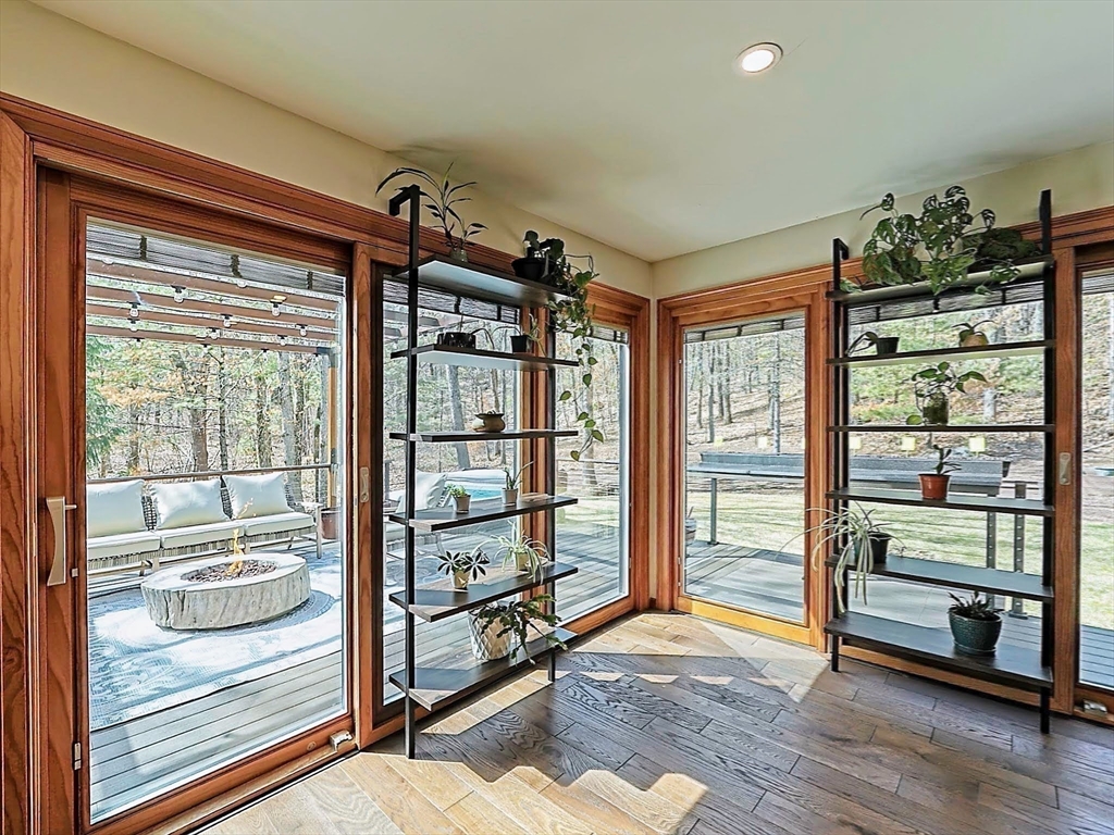 8 Fredrickson Road Norfolk, MA 02056 - Photo 24 of 39 a view of a room with racks on the wall