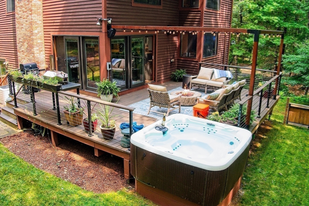 8 Fredrickson Road Norfolk, MA 02056 - Photo 3 of 39 a wooden bench sitting in front of a house