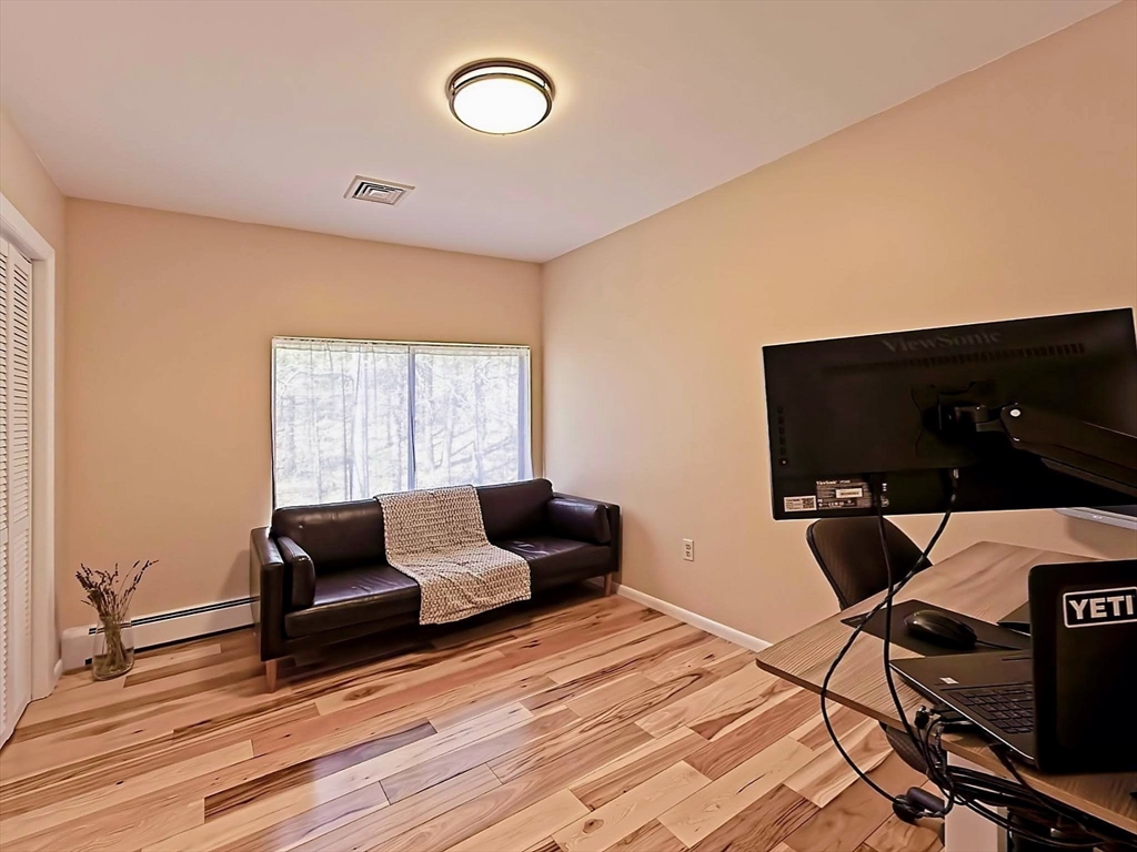 8 Fredrickson Road Norfolk, MA 02056 - Photo 33 of 39 a living room with furniture and a flat screen tv