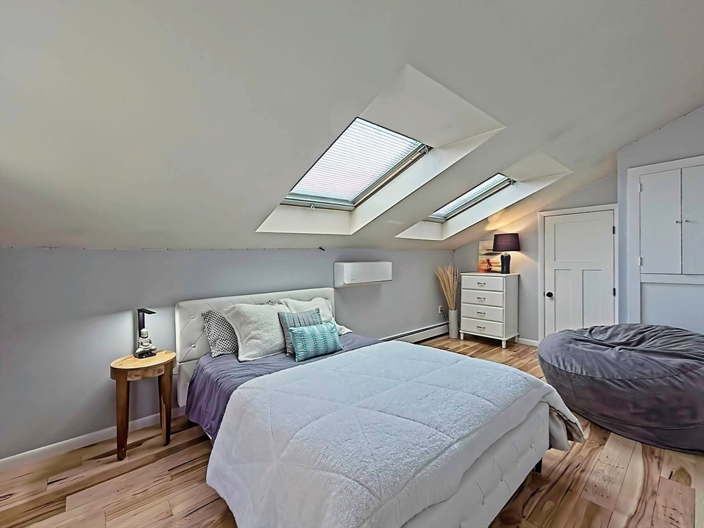 8 Fredrickson Road Norfolk, MA 02056 - Photo 34 of 39 a bedroom with a bed and a table