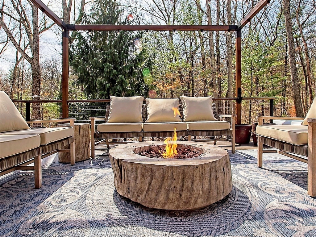 8 Fredrickson Road Norfolk, MA 02056 - Photo 7 of 39 a table and chairs sitting in the patio