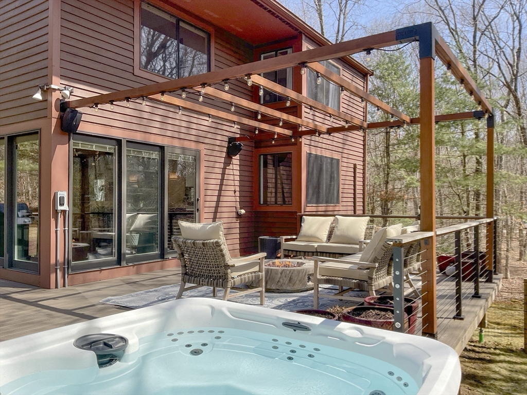 8 Fredrickson Road Norfolk, MA 02056 - Photo 8 of 39 a patio with glass top table and chairs