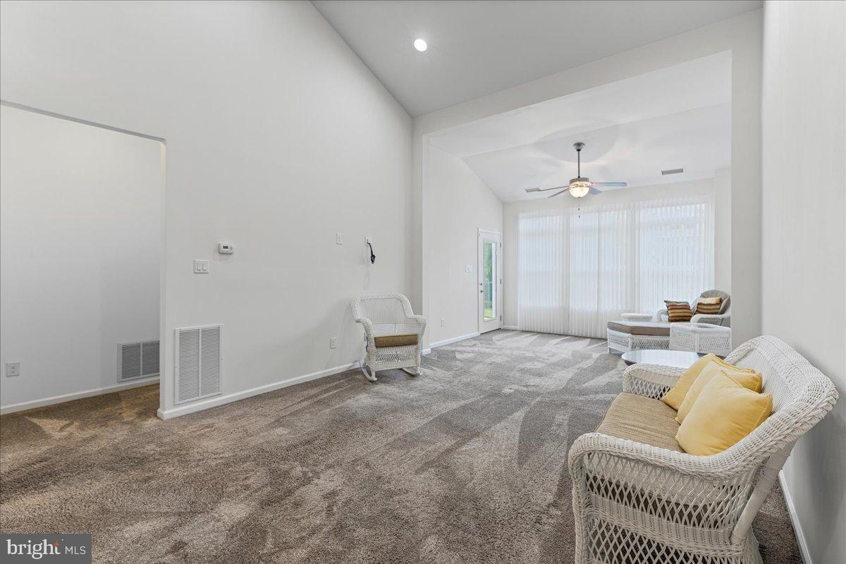 54 Heals Farm Road Burlington, NJ 08016 - Photo 11 of 26 a living room with furniture and a chandelier