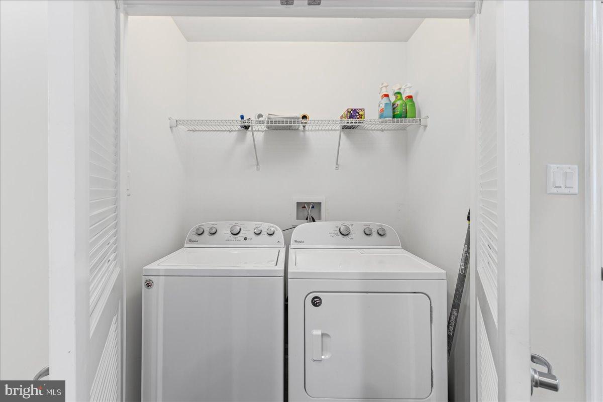 54 Heals Farm Road Burlington, NJ 08016 - Photo 9 of 26 a utility room with dryer and washer