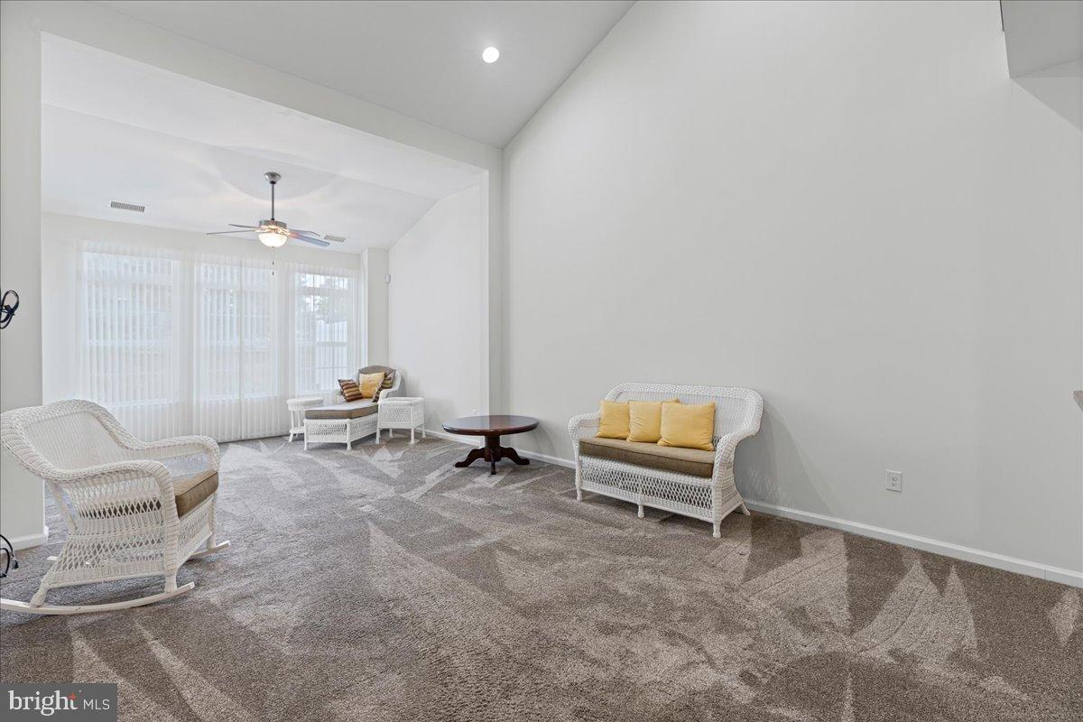 54 Heals Farm Road Burlington, NJ 08016 - Photo 10 of 26 a living room with furniture and a chandelier