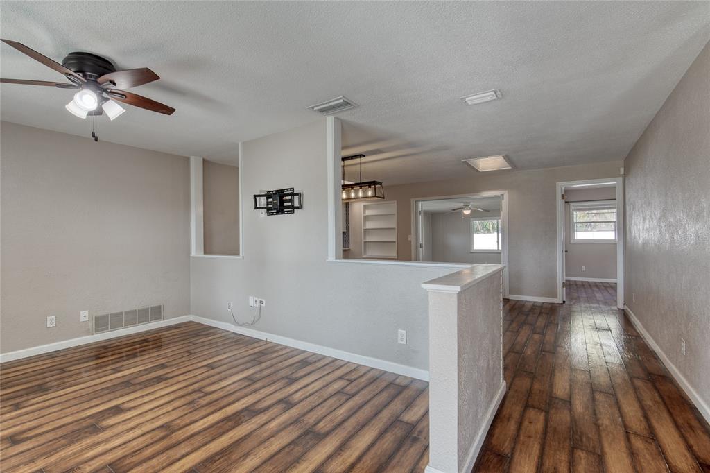 51 Rivocean Drive Ormond Beach, FL 32176 - Photo 13 of 65 wooden floor in an empty room with a window