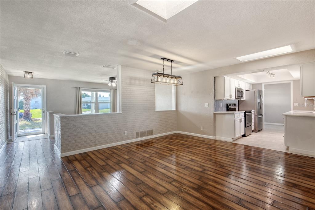 51 Rivocean Drive Ormond Beach, FL 32176 - Photo 16 of 65 a view of empty room with wooden floor