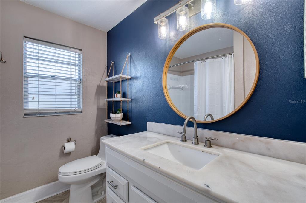 51 Rivocean Drive Ormond Beach, FL 32176 - Photo 26 of 65 a bathroom with a toilet sink and mirror