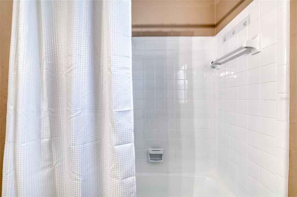 51 Rivocean Drive Ormond Beach, FL 32176 - Photo 27 of 65 a bathroom with a shower and a bath tub