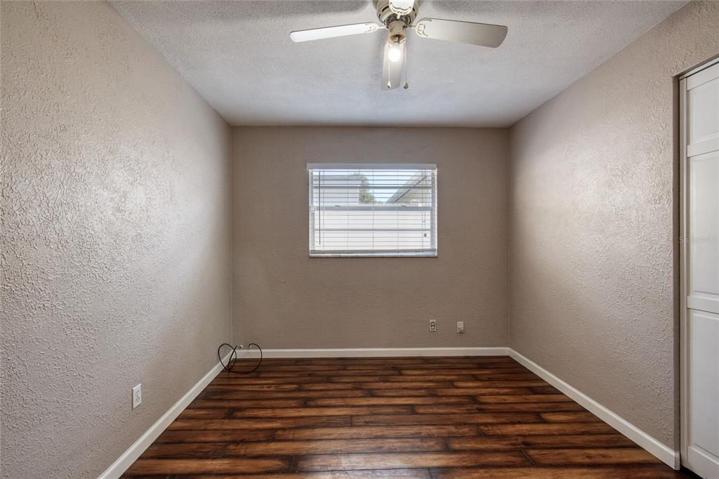 51 Rivocean Drive Ormond Beach, FL 32176 - Photo 29 of 65 a view of an empty room with wooden floor and a window
