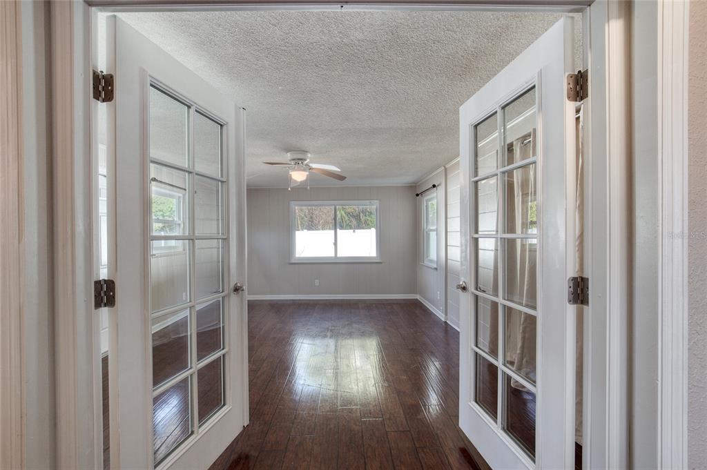 51 Rivocean Drive Ormond Beach, FL 32176 - Photo 32 of 65 a view of a hallway with wooden floor and staircase