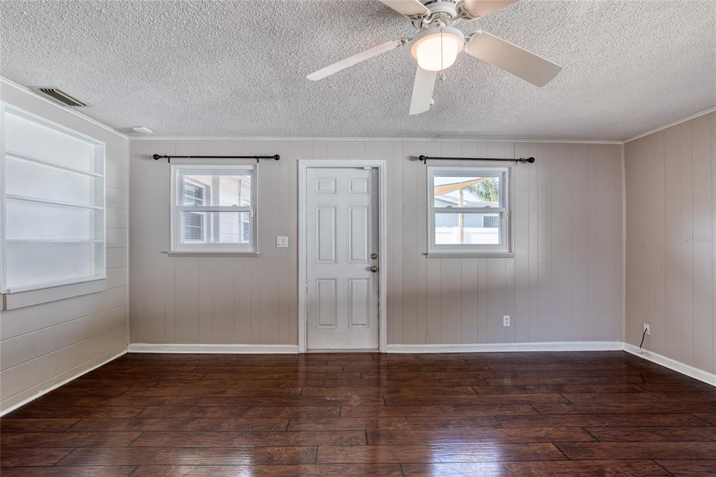 51 Rivocean Drive Ormond Beach, FL 32176 - Photo 34 of 65 a view of an empty room with wooden floor and a window