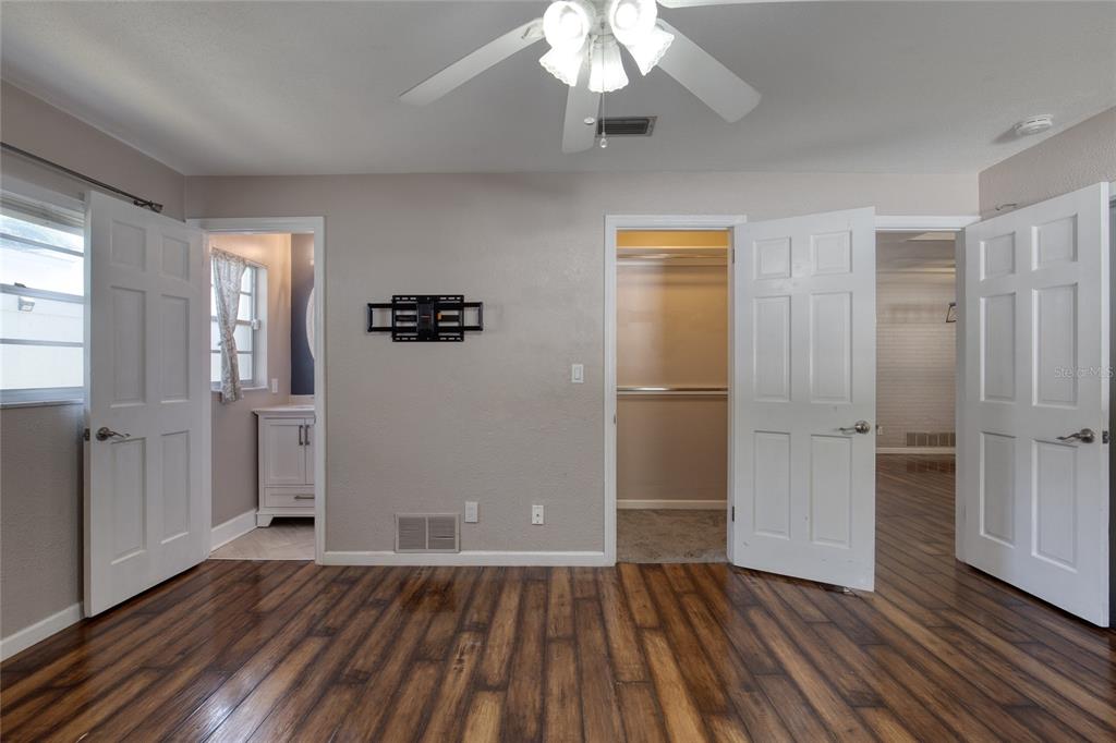 51 Rivocean Drive Ormond Beach, FL 32176 - Photo 37 of 65 an empty room with wooden floor and windows