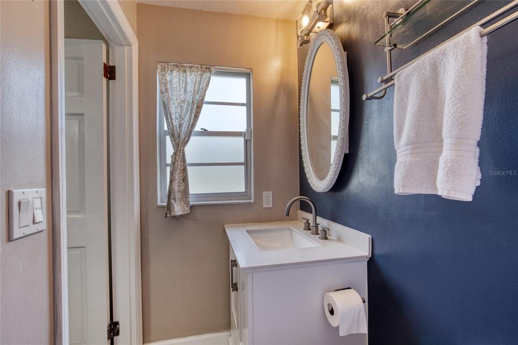 51 Rivocean Drive Ormond Beach, FL 32176 - Photo 40 of 65 a bathroom with a sink mirror and window