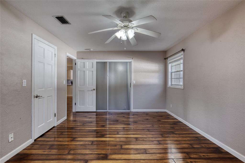 51 Rivocean Drive Ormond Beach, FL 32176 - Photo 41 of 65 a view of an empty room with wooden floor