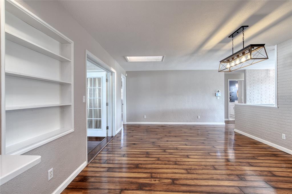 51 Rivocean Drive Ormond Beach, FL 32176 - Photo 44 of 65 a view of an empty room with wooden floor and a window
