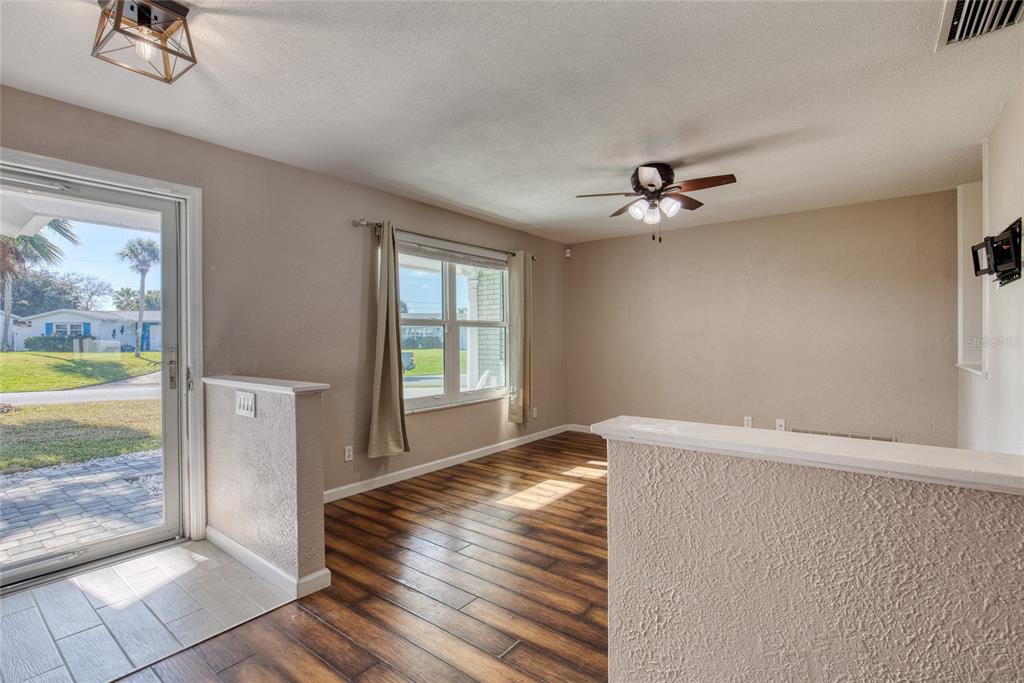 51 Rivocean Drive Ormond Beach, FL 32176 - Photo 8 of 65 wooden floor in an empty room with a window