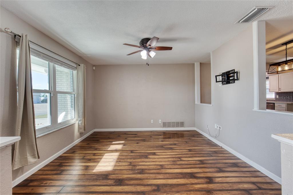 51 Rivocean Drive Ormond Beach, FL 32176 - Photo 9 of 65 wooden floor in an empty room with a window