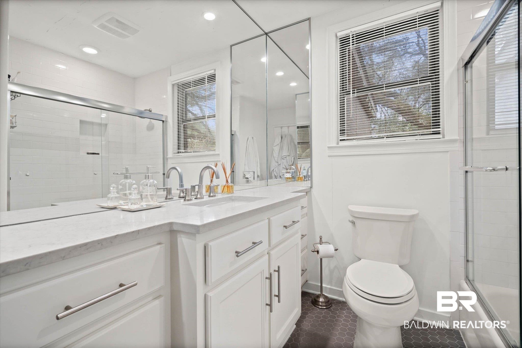 4590 Sunset Drive North Mobile, AL 36608 - Photo 19 of 35 Bathroom featuring vanity, bath / shower combo with glass door, and dark tile patterned flooring