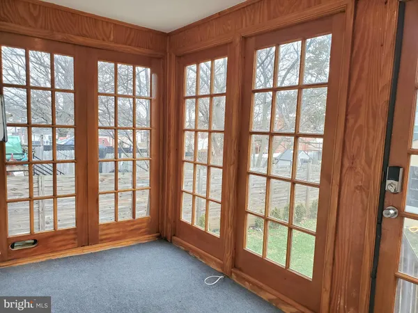 a view of an empty room with a large window