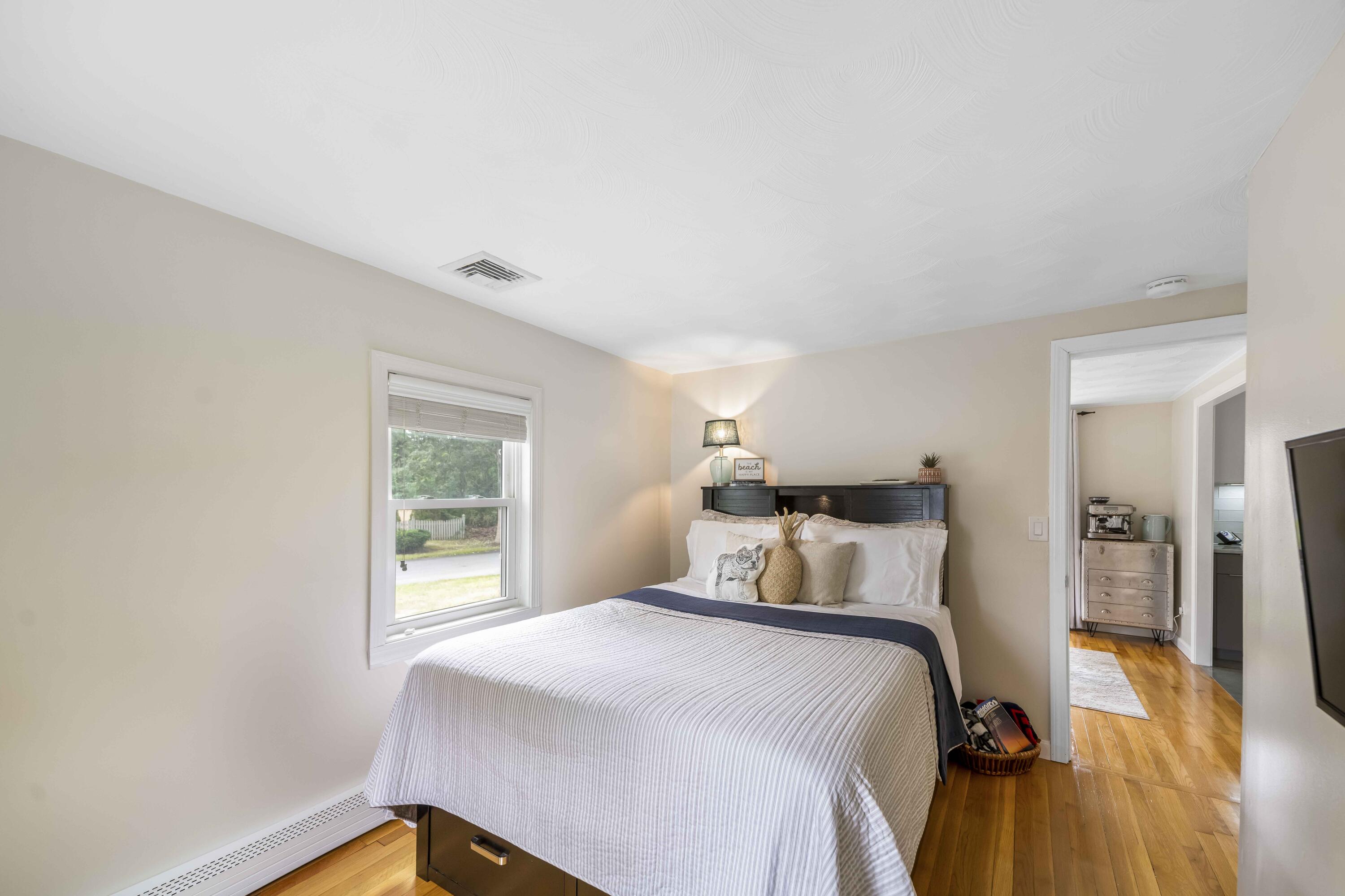 7 Arbeta Road Hyannis, MA 02601 - Photo 21 of 54 a bedroom with a bed and wooden floor