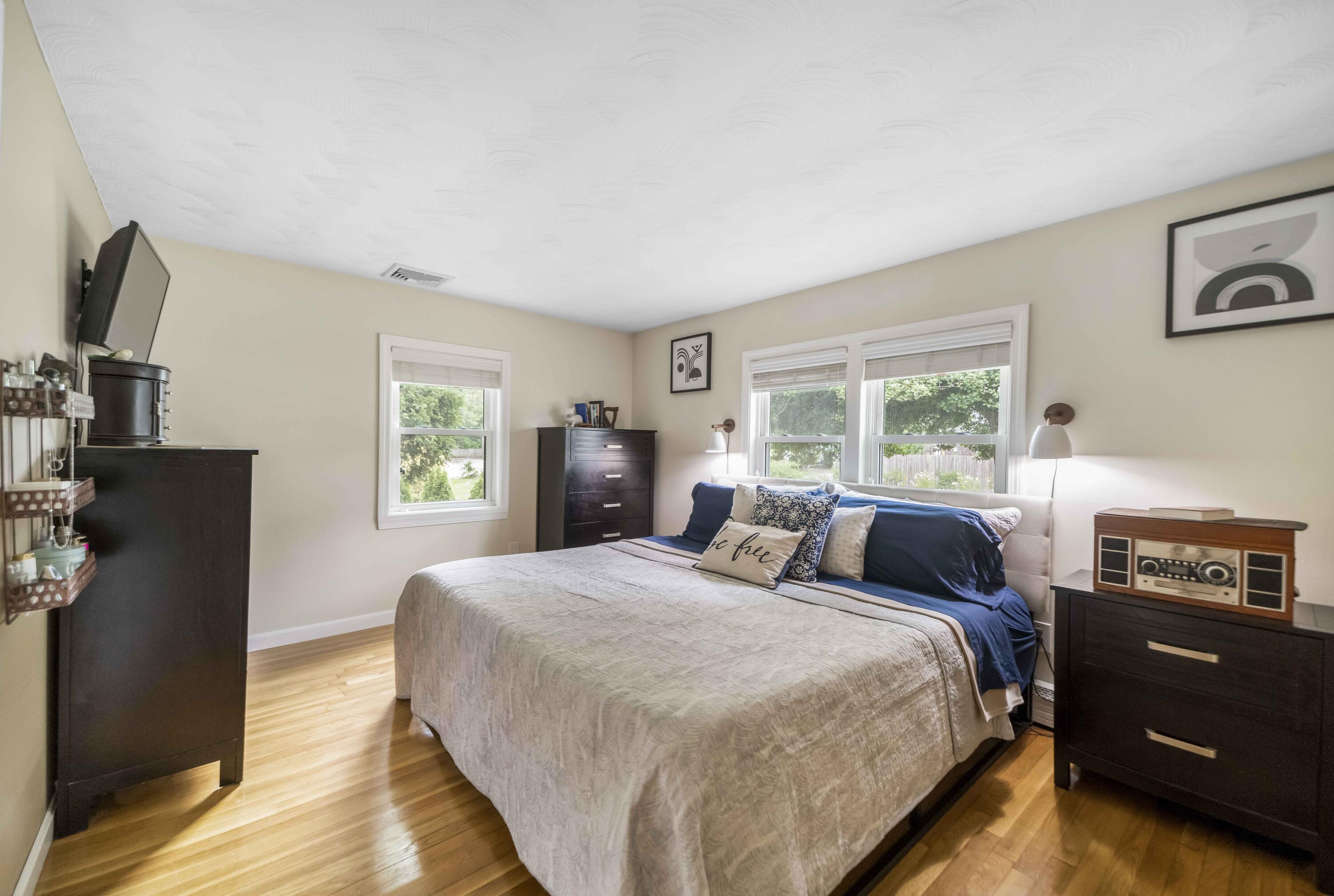 7 Arbeta Road Hyannis, MA 02601 - Photo 23 of 54 a bedroom with a bed and a tv on the dresser