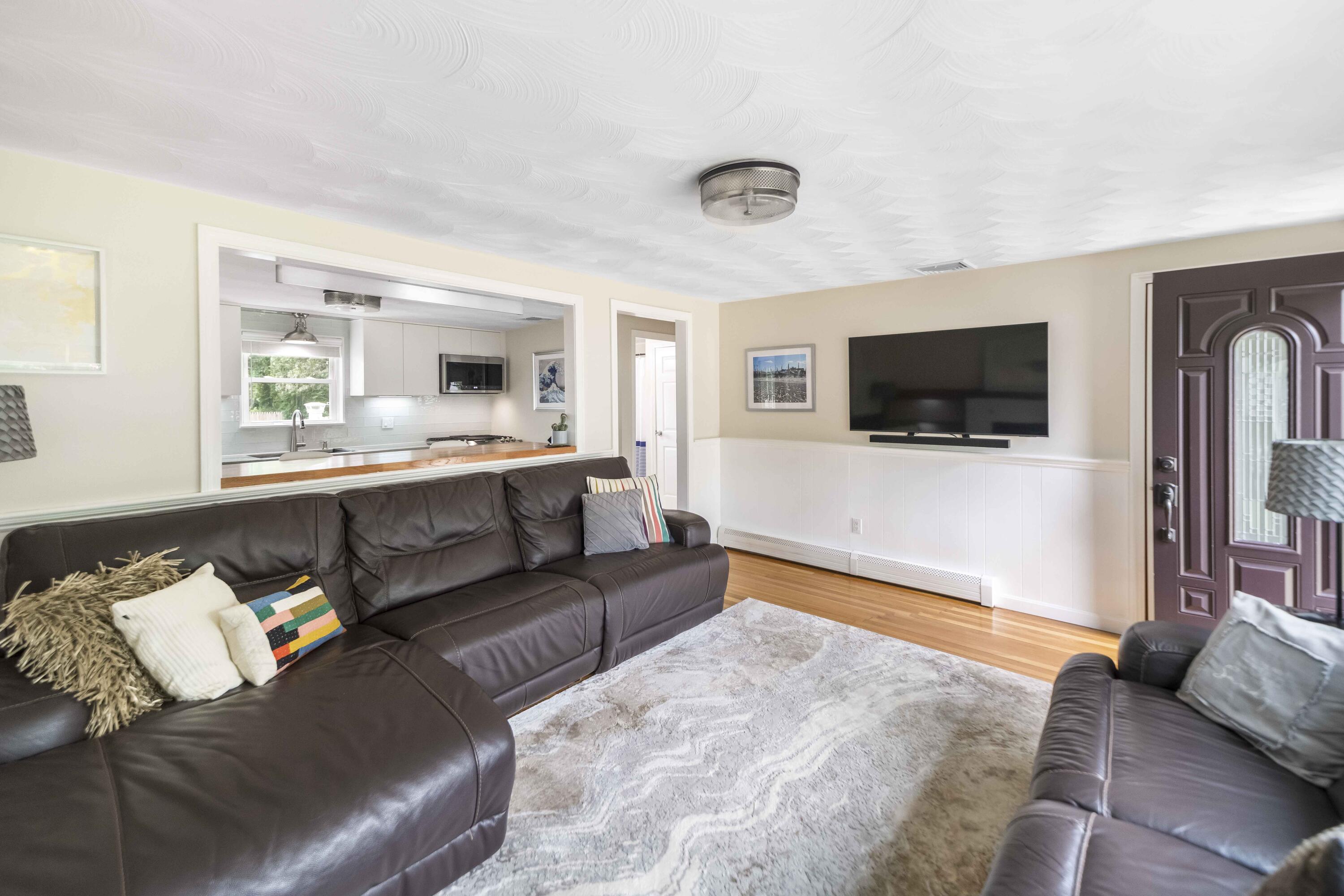 7 Arbeta Road Hyannis, MA 02601 - Photo 26 of 54 a living room with furniture and a flat screen tv