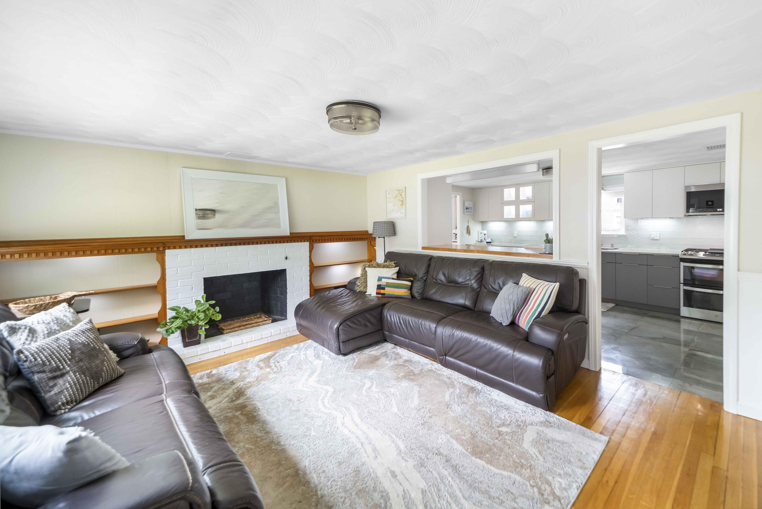7 Arbeta Road Hyannis, MA 02601 - Photo 27 of 54 a living room with furniture and a fireplace