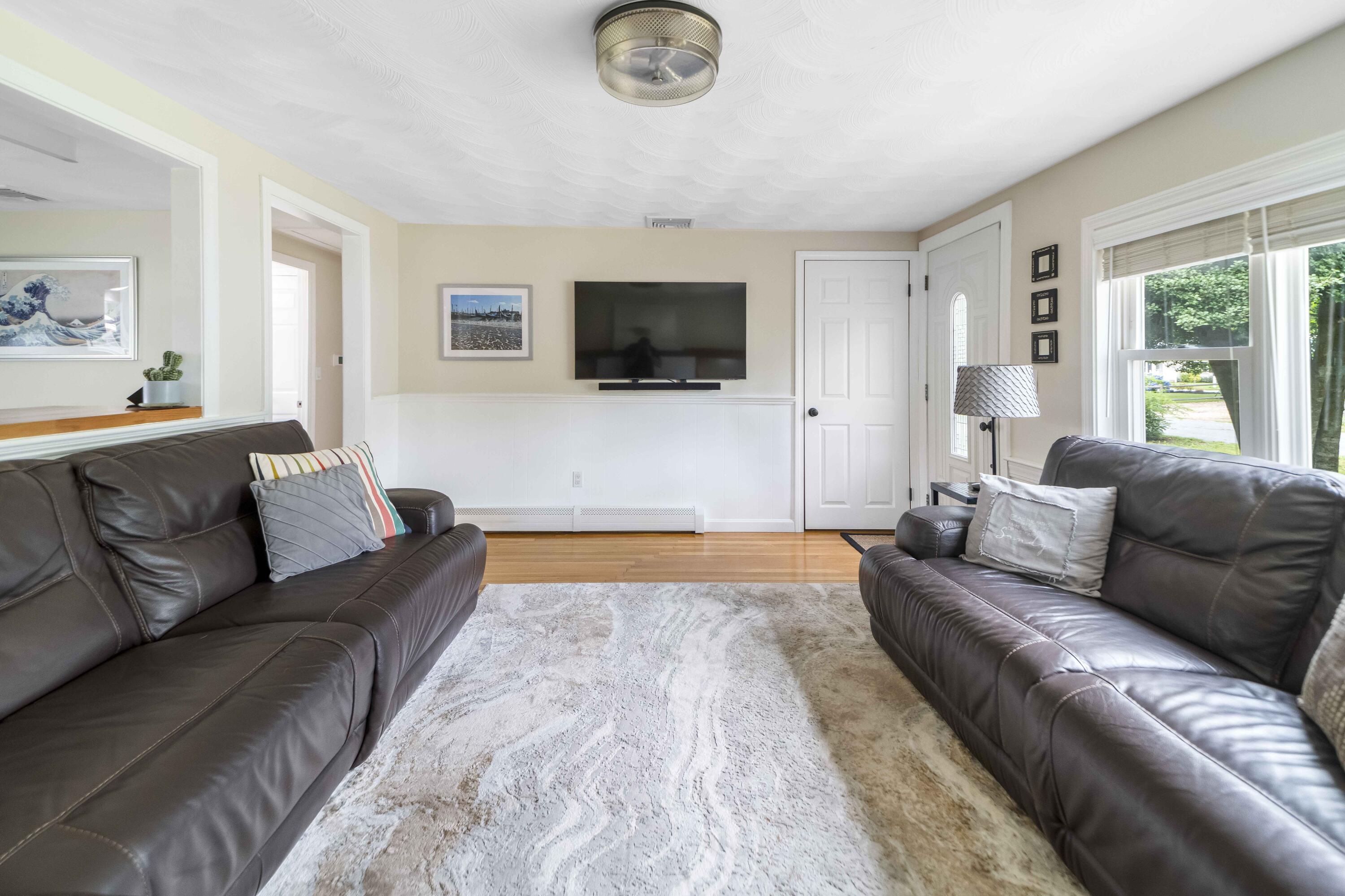 7 Arbeta Road Hyannis, MA 02601 - Photo 28 of 54 a living room with furniture and a flat screen tv