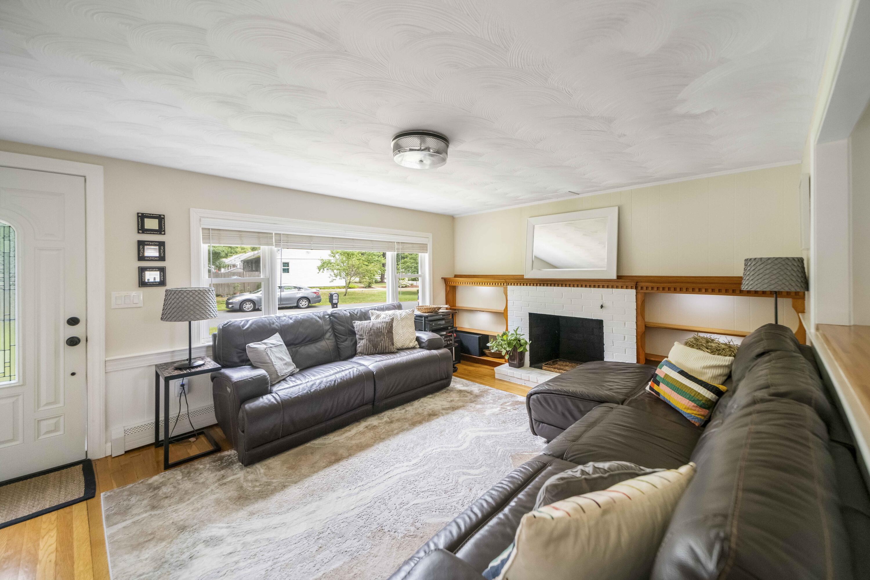7 Arbeta Road Hyannis, MA 02601 - Photo 29 of 54 a living room with furniture and a fireplace